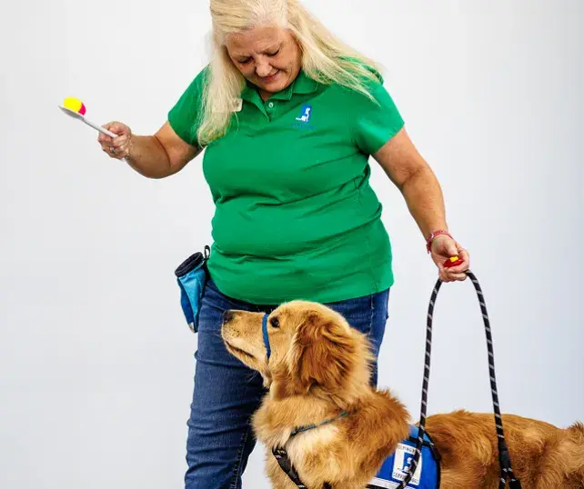 Volunteer with assistant dog