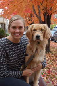 Women in a dark top with a service dog