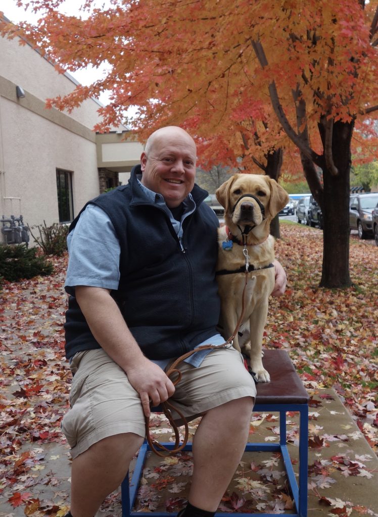 Man with a service dog